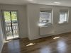 Attraktives Wohnensemble mit zwei Häusern und vier Wohneinheiten in Feldrandlage von Limeshain - Wohnzimmer OG Neubau