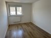 Attraktives Wohnensemble mit zwei Häusern und vier Wohneinheiten in Feldrandlage von Limeshain - Schlafzimmer OG Neubau