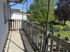 Attraktives Wohnensemble mit zwei Häusern und vier Wohneinheiten in Feldrandlage von Limeshain - Balkon OG Neubau