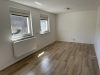 Attraktives Wohnensemble mit zwei Häusern und vier Wohneinheiten in Feldrandlage von Limeshain - Wohnzimmer Ansicht OG Neubau
