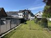 Attraktives Wohnensemble mit zwei Häusern und vier Wohneinheiten in Feldrandlage von Limeshain - Hausansicht Gartenseite