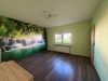 Familienfreundliches Zweifamilienhaus mit großem Garten und vielseitigem Potenzial. - Wohnzimmer EG