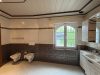 Großzügige Erdgeschosswohnung mit Garten, Terrasse und vielseitig nutzbarem Untergeschoss - Ansicht Tageslichbad